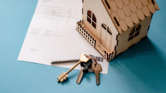 a small wooden house on paperwork